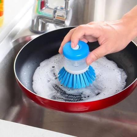 Self dispensing dish cleaning brush with soap dispenser